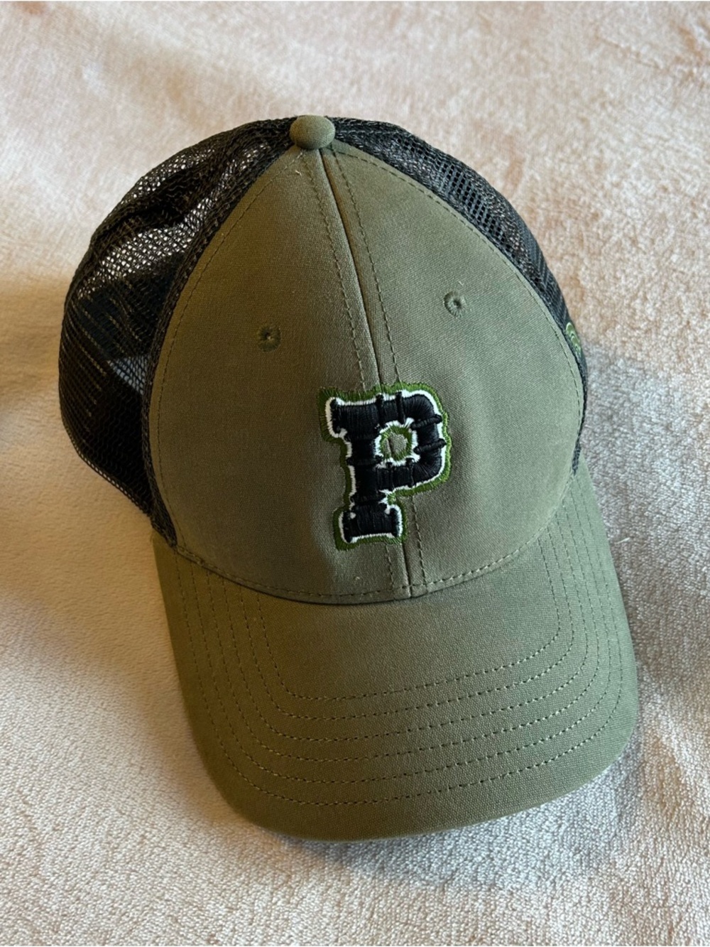 The North Face green with black mesh trucker hat P on the front OSFA
